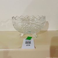 clear pressed glass footed bowl on display with lot tag visible