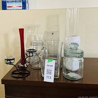 Group shot of seven glass and metal décor items on table