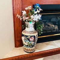 Full view of ceramic vase with floral arrangement