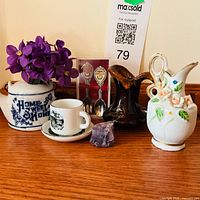 All miniature souvenir items arranged on wooden surface