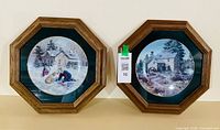 Front view of both framed plates showing artwork and frames