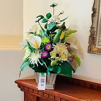 Full view of artificial floral arrangement in wooden pot