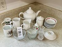 Overview of all ceramic and glass items on countertop