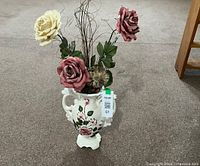 Full view of ceramic vase with artificial flowers