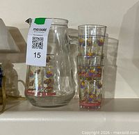 Pitcher and stacked tumblers showing size, shape and floral decoration