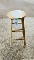 full view of wooden round-top stool