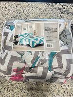 Packaged bedding set showing product image and pattern