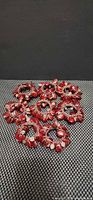 overview of eight red glass bead napkin rings