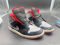 Lateral view of both shoes showing colorway and overall wear