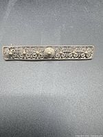 front view of rectangular sterling filigree brooch