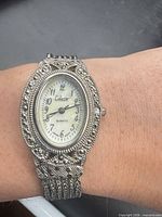 Watch on wrist showing dial and case details