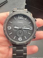 Front view of Fossil chronograph showing dial, numerals, sub-dials, bracelet