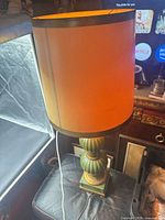 Full lamp showing shade lit and base