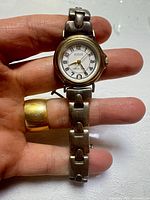 Front view showing dial, case, and bracelet links