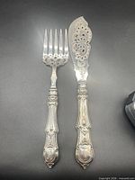 Full view of fork and knife on black background