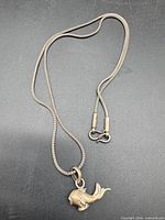 Full view of .800 silver chain and attached whale pendant