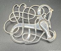 Front view of openwork sterling silver brooch