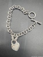 Full view of sterling toggle bracelet with heart charm