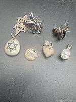 Overall view of all seven sterling silver pieces