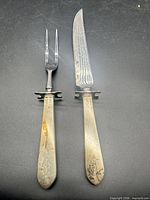 Overview of carving knife and fork showing full length and design