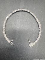 Full view of sterling silver tennis bracelet laid flat