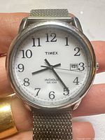Front view of Timex watch showing dial, hands and date window