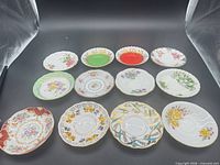 Top view of all twelve bone china saucers