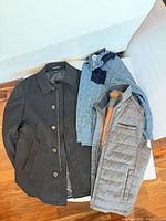 Overcoat, sweater and vest grouped