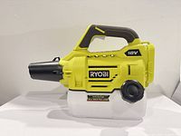 Right side view of Ryobi 18V sprayer showing housing, handle, and tank