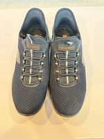 Top view showing pair of Skechers blue slip-on shoes with elastic laces