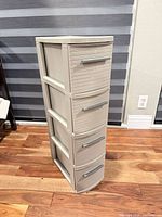 Front three-quarter view of tower showing four drawers and color