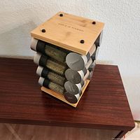 Front angled view of bamboo stand with stacked jars