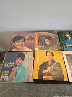 First group of five albums on tabletop