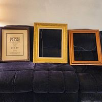 Three frames on sofa showing overall condition and finishes
