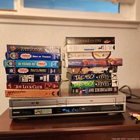 Front view of Sony RDR-VX500 with stacked VHS tapes