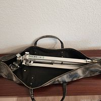Folded Velbon VGB-3 tripod inside carry case