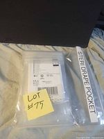 Overall lot showing sealed 3M Steri-Drape pocket package inside clear bag with label