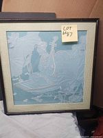 Front view of framed embroidered artwork