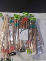 Multiple sealed packs of EMF training chopsticks with colored clips