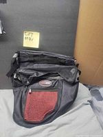 Front view of black Shimano XTR saddle bag showing red zip pocket and logo