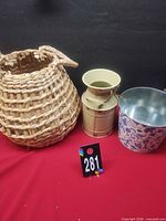 All three items side by side: wicker basket, cream jug, floral bucket