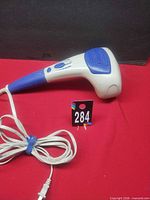Full view of Dr. Scholl's corded handheld body massager with cord
