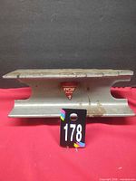 Side view showing rail-style anvil profile and maker’s badge