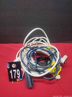 Tangled group of all six call button assemblies showing variety of cables and connectors