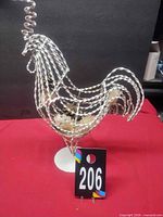front view of twisted wire rooster on base