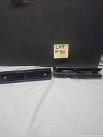 Both black metal 3-hole punches side by side