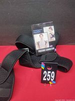 Brace and instruction booklet overall view with lot tag