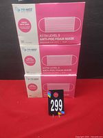 Three stacked sealed boxes of Pri-Med ASTM Level 3 anti-fog foam masks, lot number visible