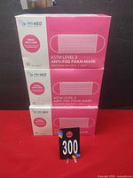 Three stacked sealed boxes showing front labeling