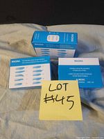 Front view of three boxes showing brand and blade illustrations